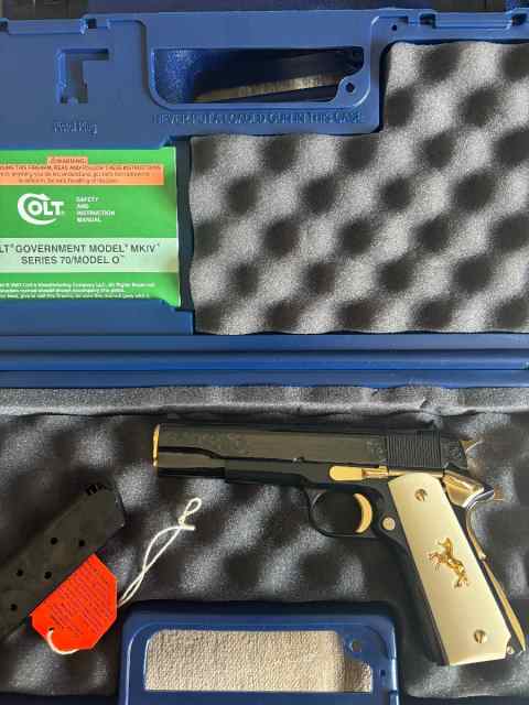 Factory engraved. Colt 1911 high gloss blue. 